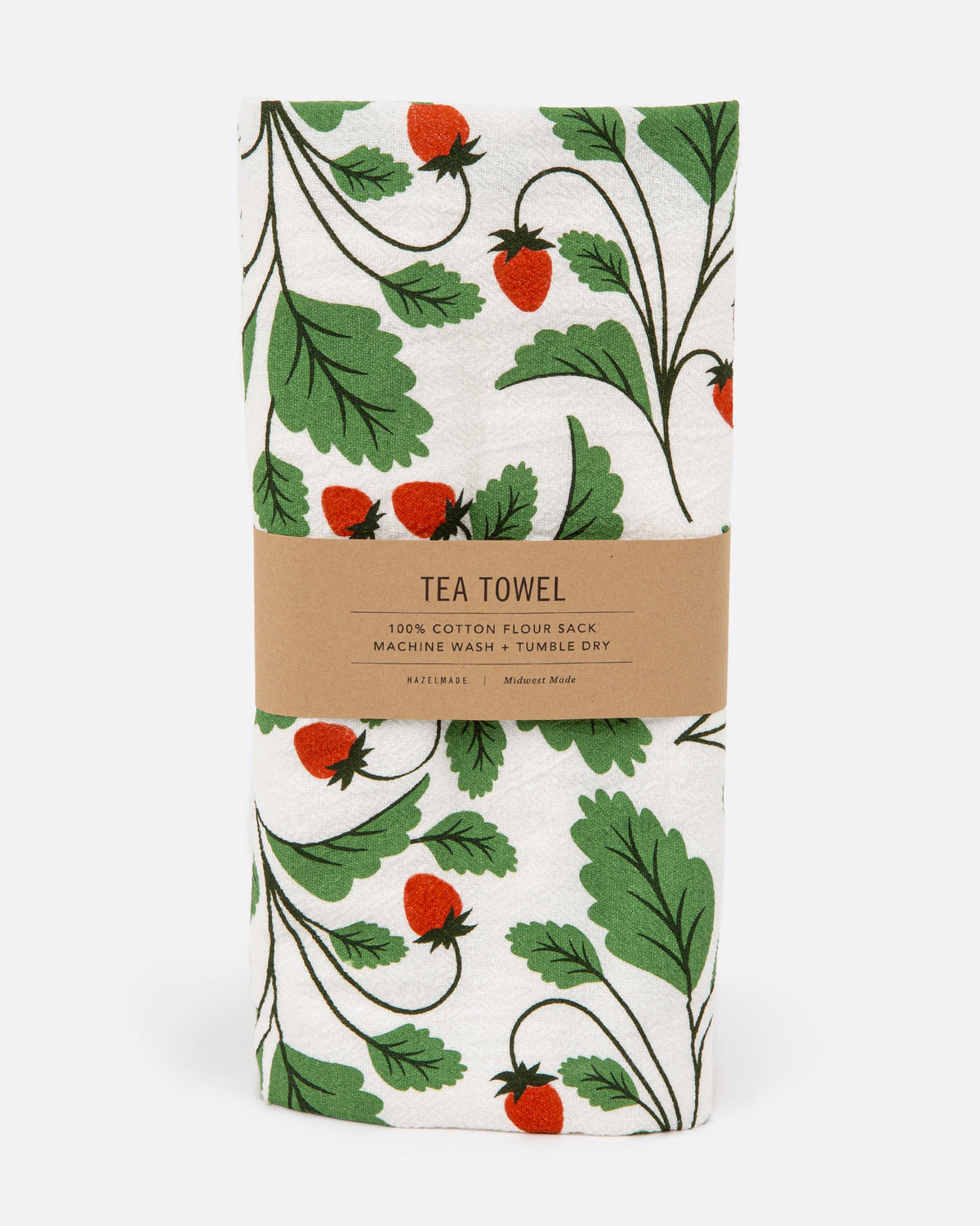 A tea towel with a strawberry pattern. Shown folded in its paper wrapping.