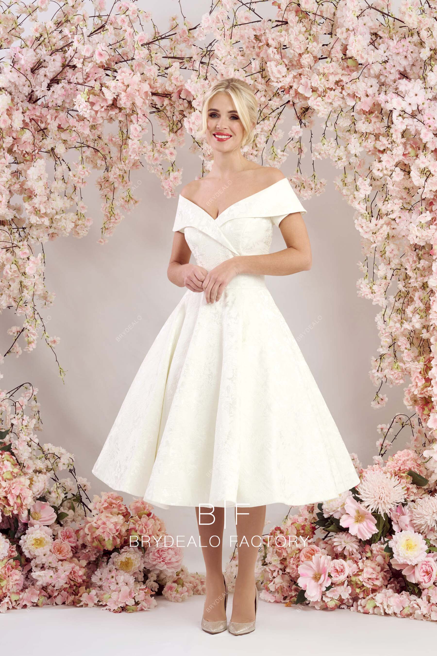 designer V-neck off shoulder A-line wedding gown