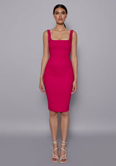 Model wearing the VSPR Zada Cerise Midi Dress featuring a square neckline, wide shoulder straps, and bodycon pencil silhouette, set against a minimalist grey studio backdrop.