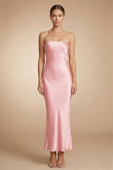 Front view of blush pink satin strapless midi dress with soft silhouette