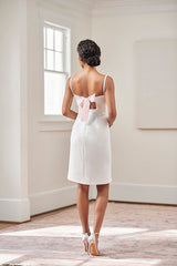 bride in short white backless blush pink ribbon tie bridal shower dress and rehearsal dinner and civil wedding dress