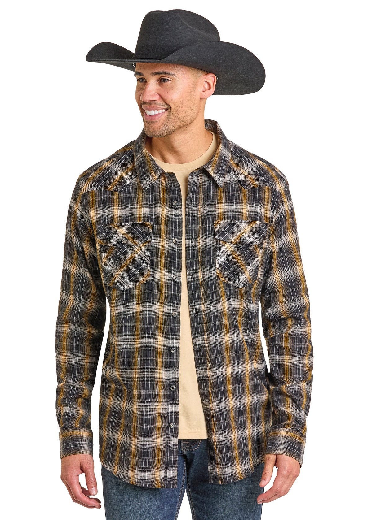 Man wearing a black cowboy hat and plaid shirt on a white background
