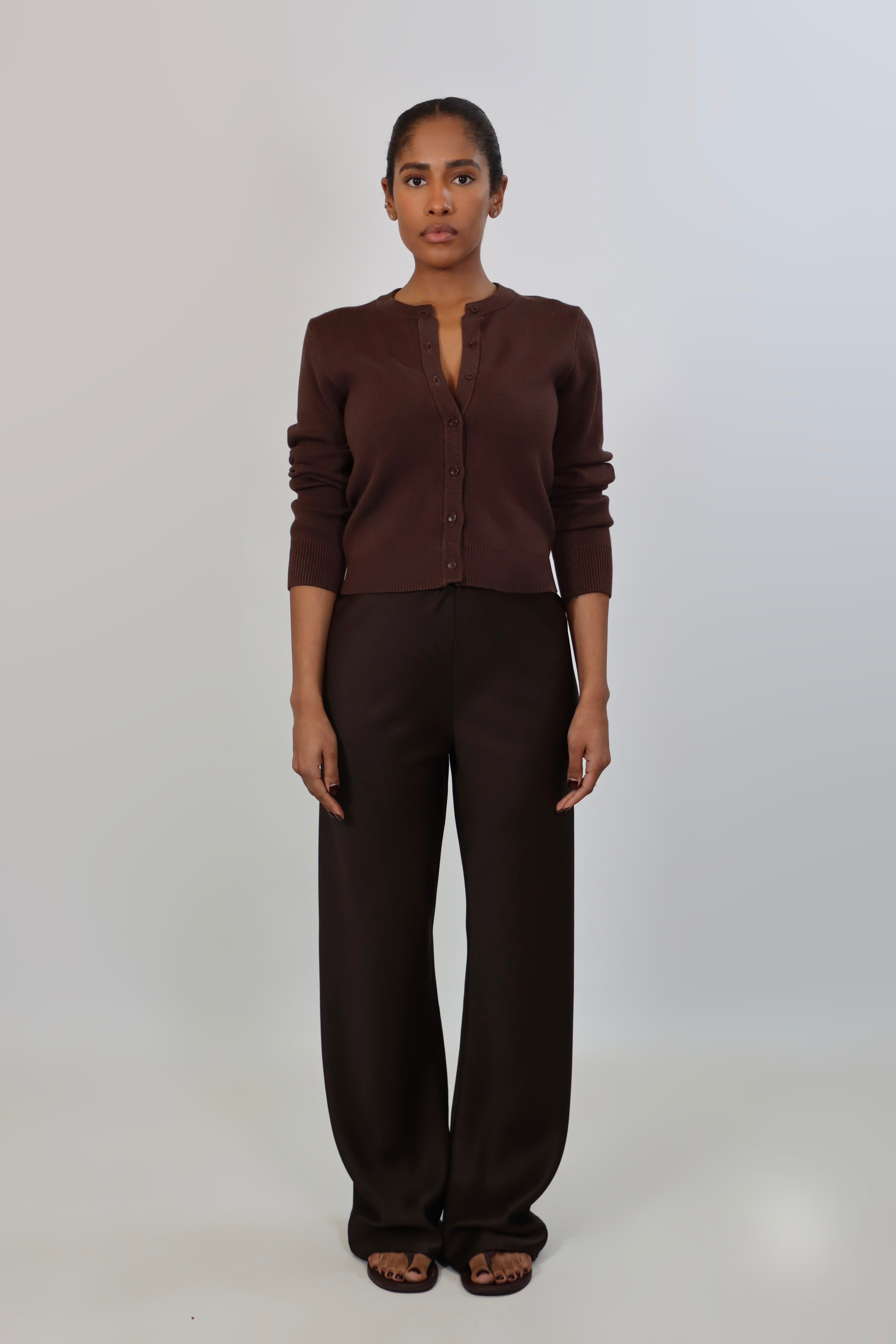 Elegant mid-waist wide-leg satin pants in a rich espresso brown shade, featuring a smooth, glossy finish and a fluid drape for a sophisticated, effortless look.