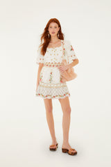 FARM Rio model wearing the Off-White Flower Embroidery Scalloped Mini Dress