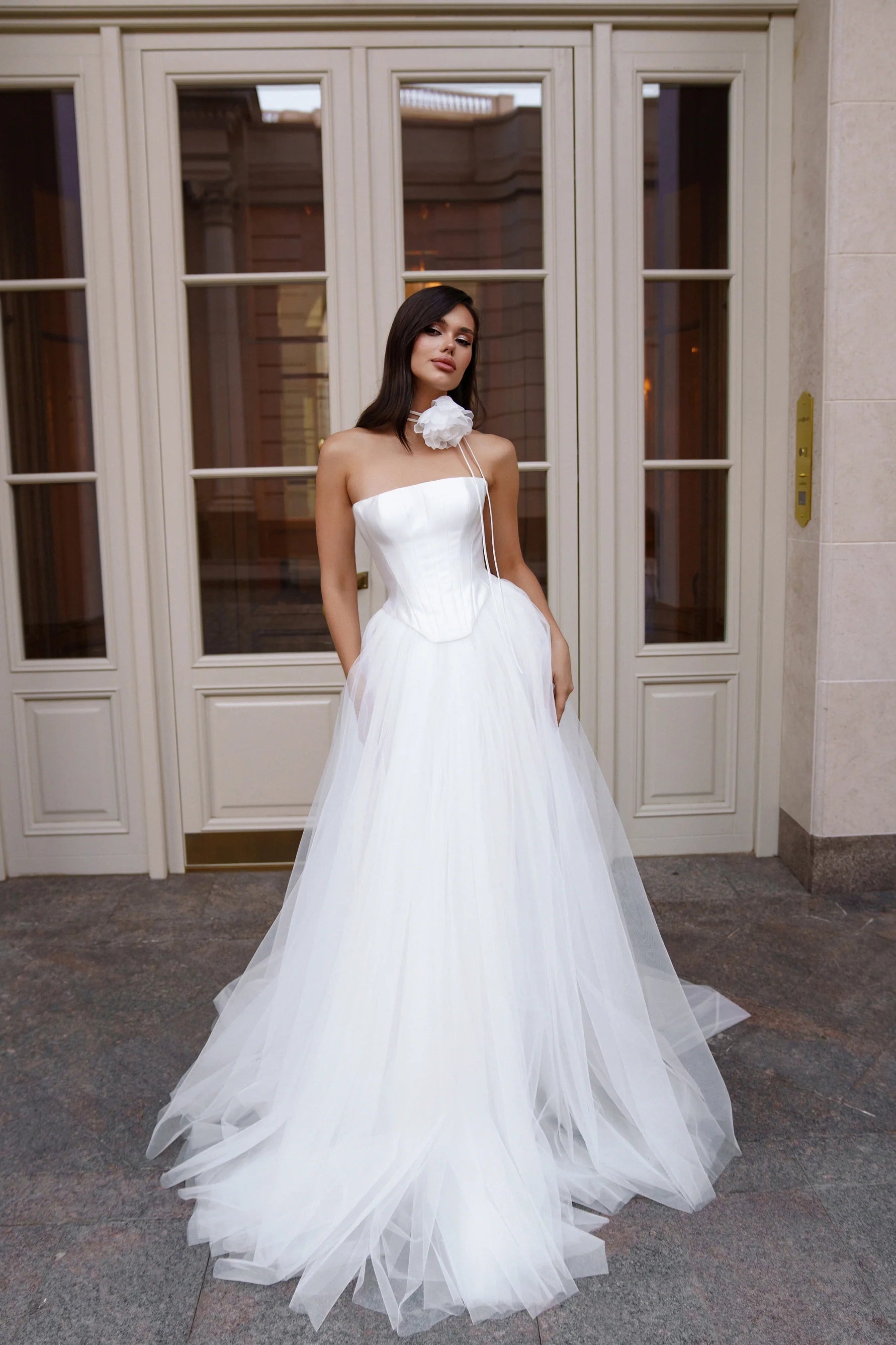 Bride in Limerence gown featuring strapless corset bodice, tulle skirt, and pockets