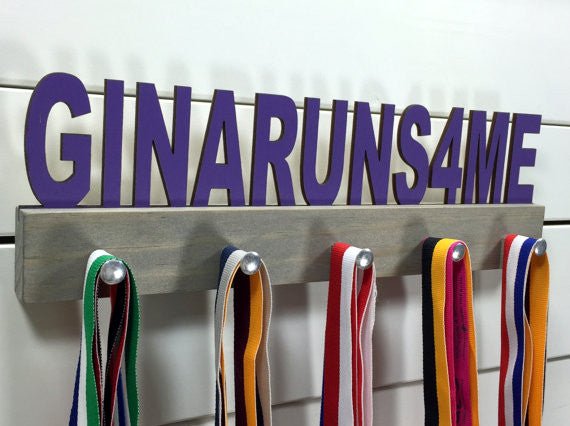 Our Custom Phrase & Font medal holder is the perfect gift for any award-winner. You choose your color, font, and phrase, and we'll create a unique display just for you!