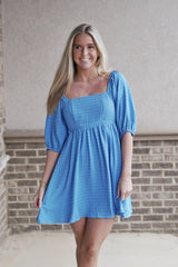 Belle Blue Puff Sleeve Babydoll Dress Square Neckline Short Puff Sleeves Smocked Bock Textured Material Color: Blue Mini Length Babydoll Fit 100% Polyester