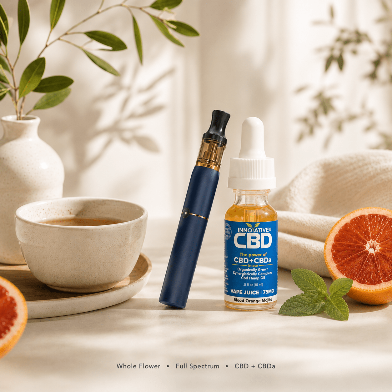 Innovative CBD Blood Orange Mojito full spectrum CBD vape juice with premium vape pen styled in a luxury wellness setting with blood orange, mint, and soft natural light.