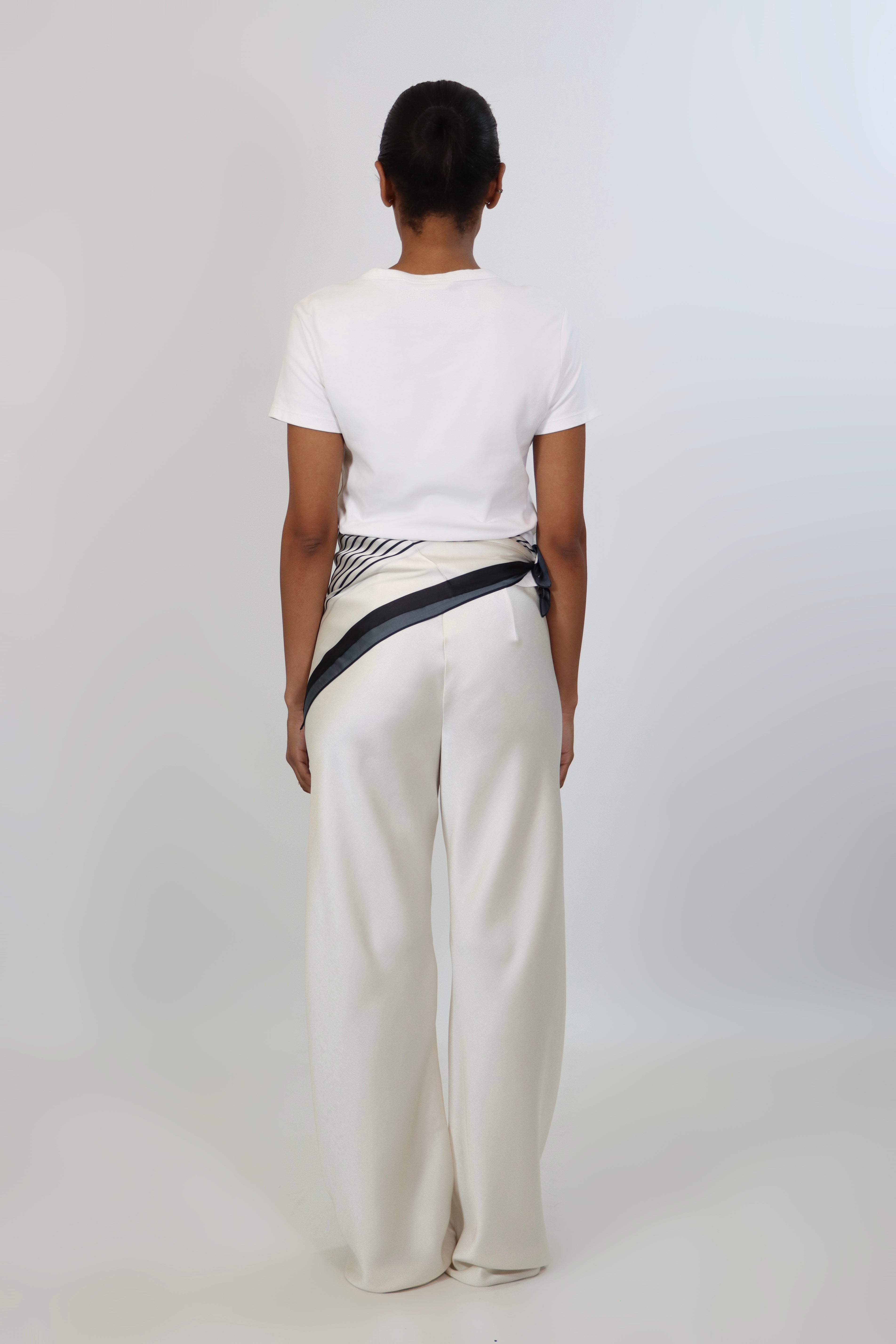 Ivory satin pants with soft drape and elastic waistband, styled with the April Seven scarf.