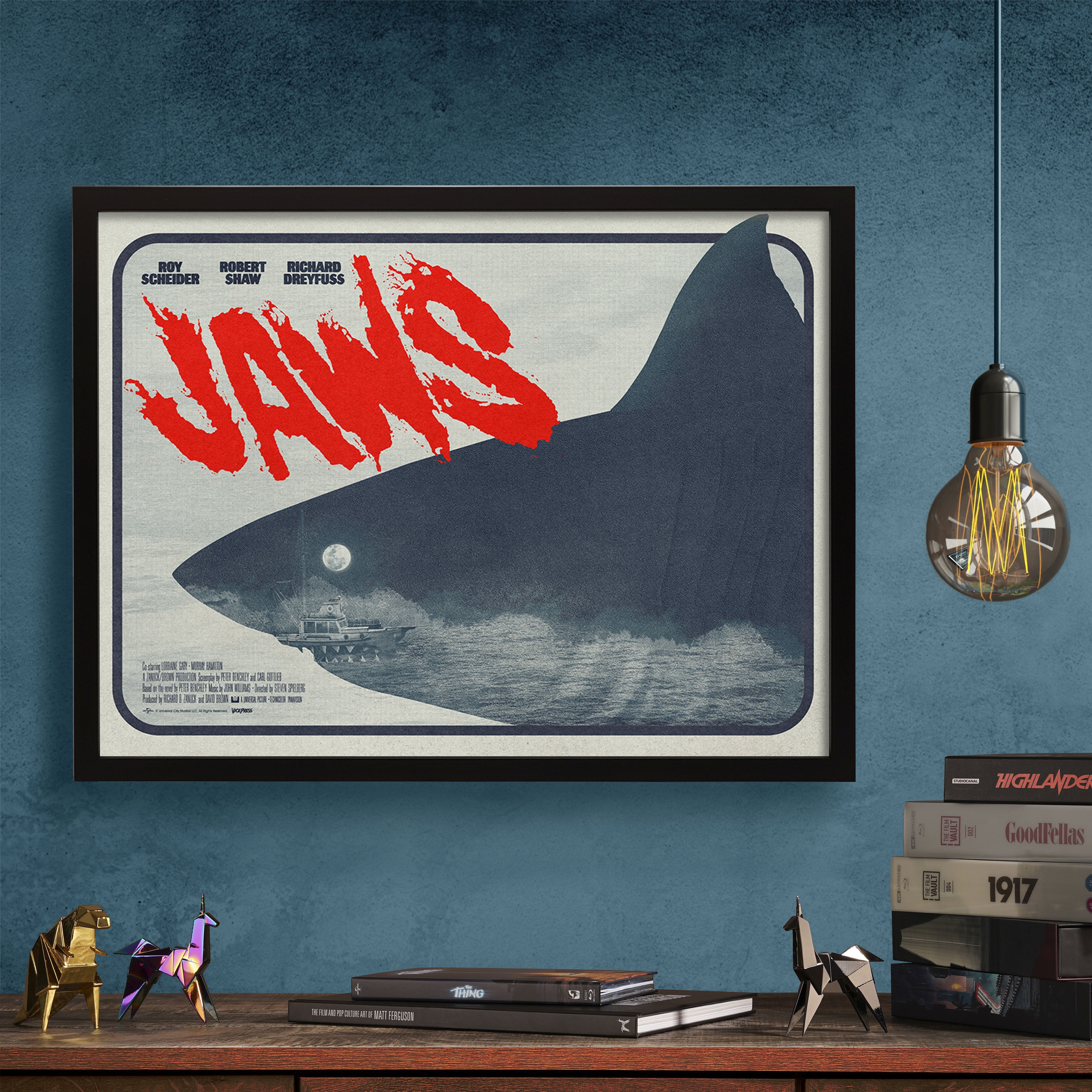 Jaws movie poster by Matt needle in black frame on a wall