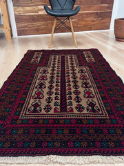 Close up picture of a Baluch Turkmen Prayer Rug - Handmade Wool Carpet in a 3x5 size, featuring traditional tribal geometric patterns with rich red, black, beige, green, and teal colors. Ideal for living room, bedroom, kitchen, entryway, or nursery decor. Available at a handmade rug shop in the San Francisco Bay Area.