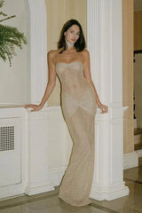 Model wearing the Kouvr Fashion Isabela strapless glitter gown in champagne with matching choker at a formal event