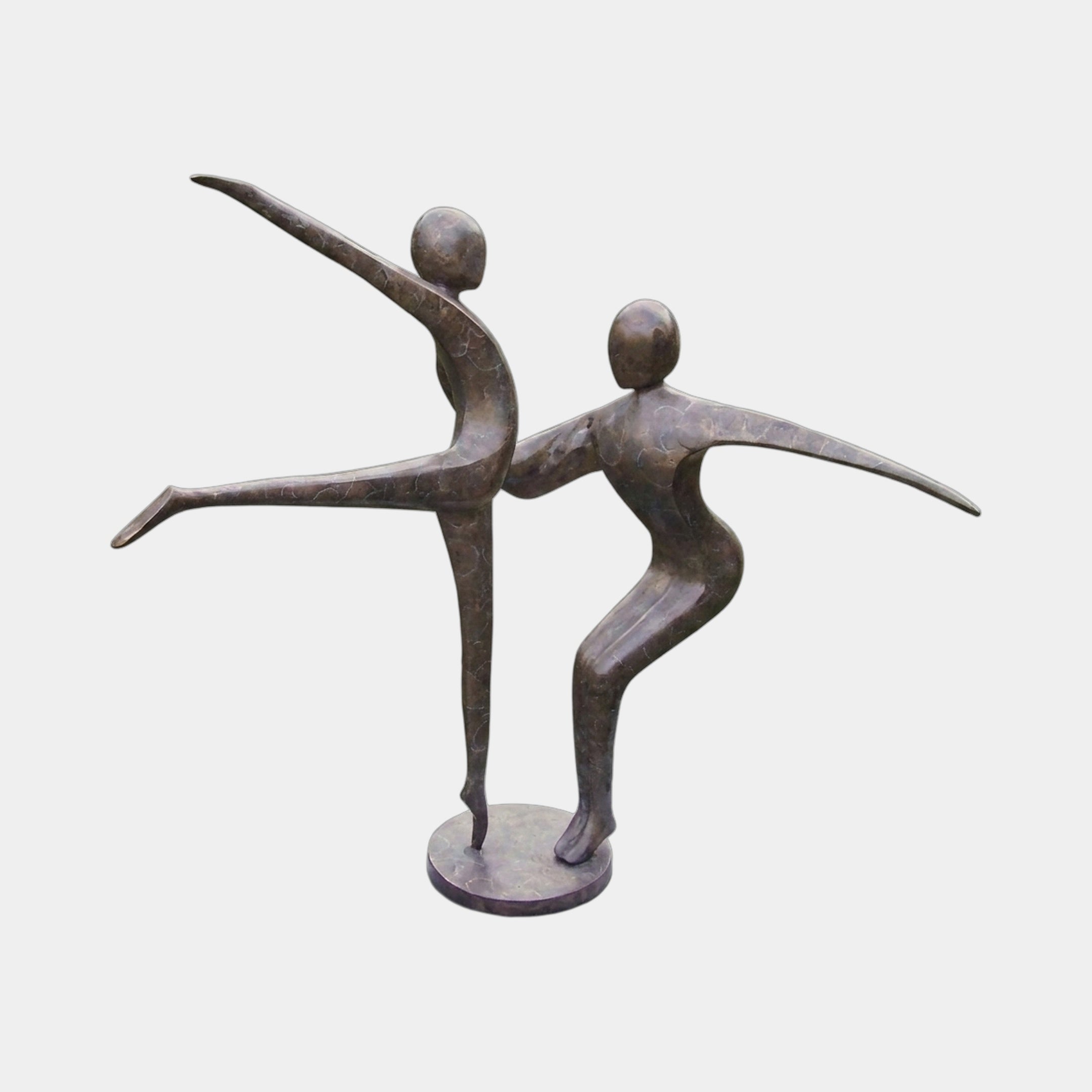 Large Contemporary Dancing Figures Bronze Sculpture by Giant Sculptures, two elongated abstract figures mid-movement on a round base, shown against a plain background.