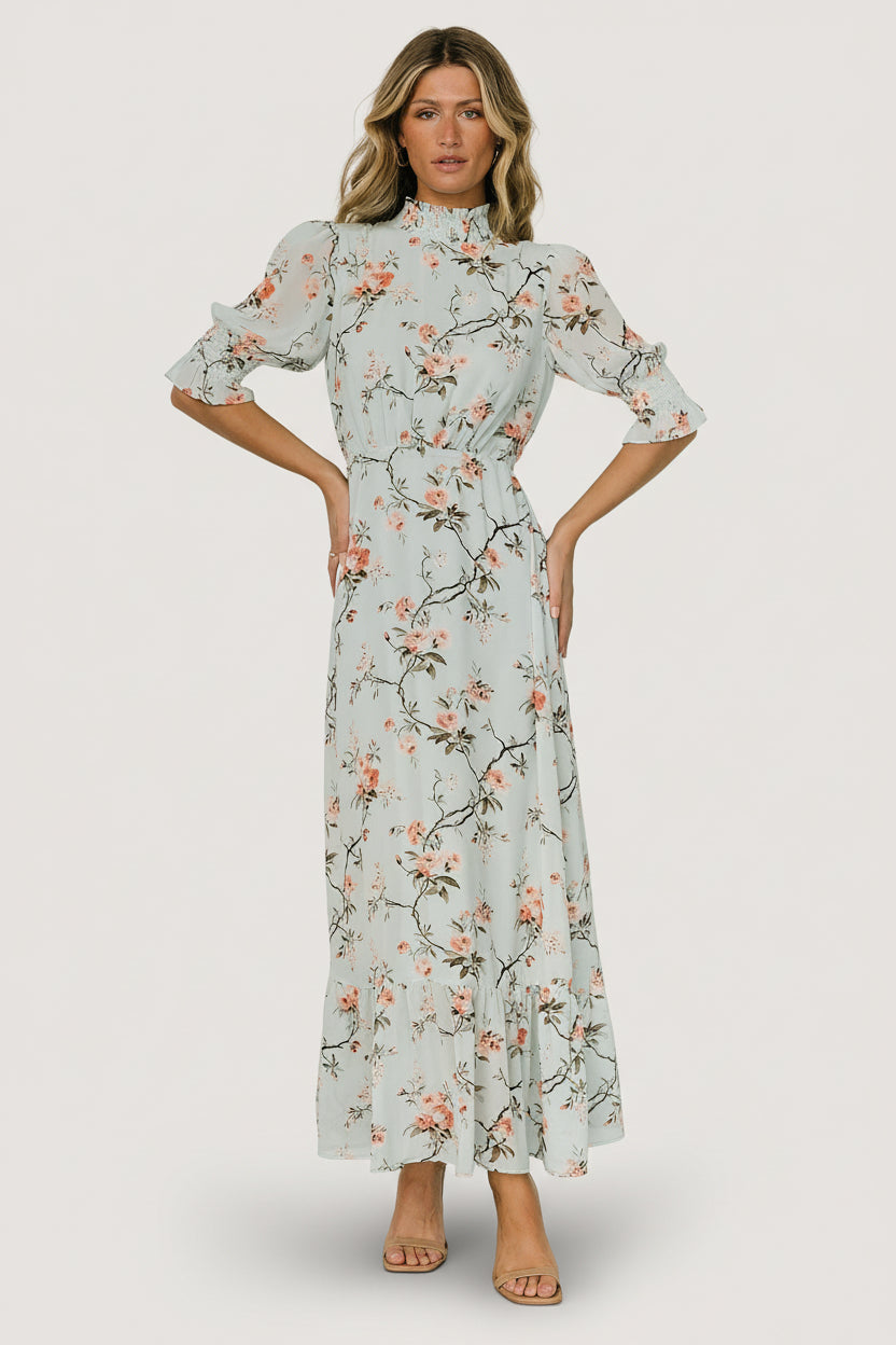 Front view of Marie Mock Neck Maxi Dress in sage floral print, chiffon fabric, high smocked neckline, keyhole back and single-tier maxi skirt.
