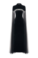 Black velvet maxi dress with cape details by Happy Clothing, featuring elegant flowing fabric and stylish cape accents.