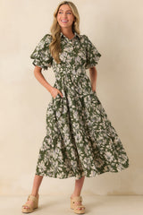 Full body front view of the olive green floral maxi dress showing the collared neckline, functional button front, and flowing tiered skirt.