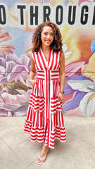 Eliza striped maxi dress by Peach Love California featuring a flowy silhouette and vibrant vertical stripe pattern.