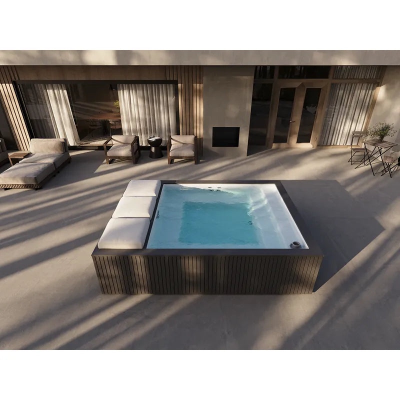 Portcril Mirage Spa Whirlpool mit Massagedüsen in moderner Terrassenlandschaft mit Loungebereich