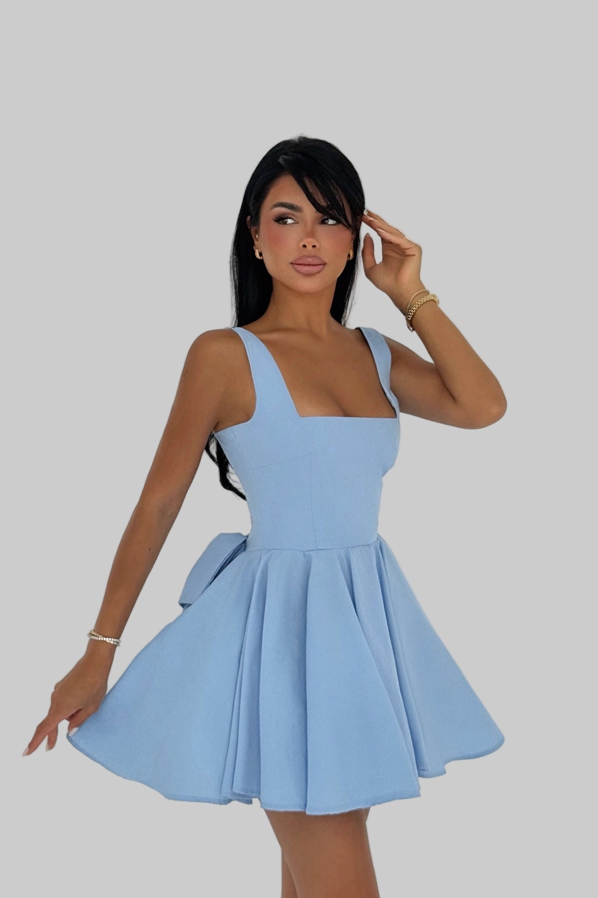 Model wearing blue bow-back skater dress with flared skirt – LARYVOE women’s clothing