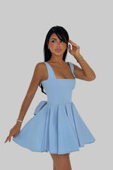 Model wearing blue bow-back skater dress with flared skirt – LARYVOE women’s clothing