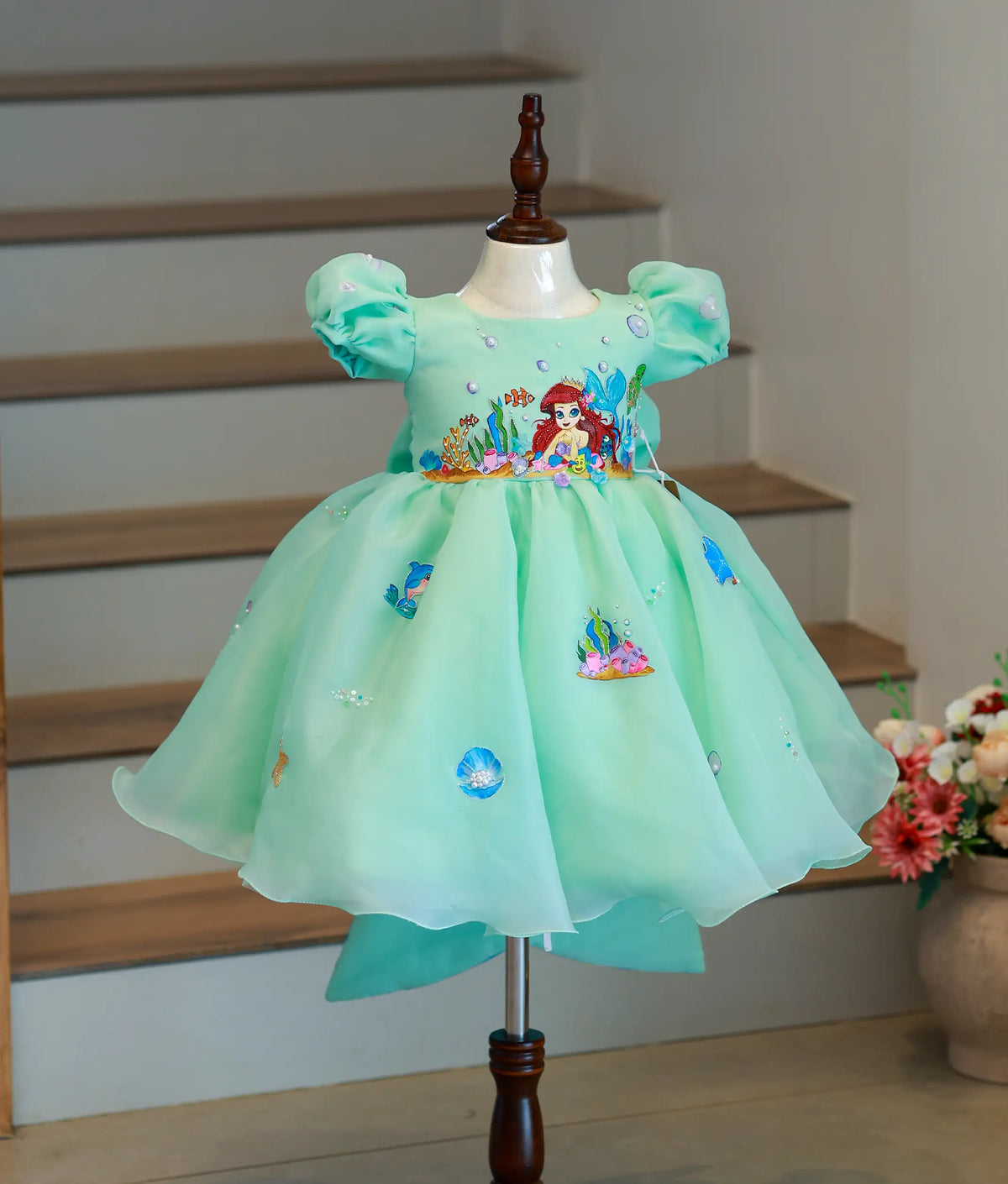 Front view of a sea green mermaid theme birthday dress for girls with hand-painted sea creatures