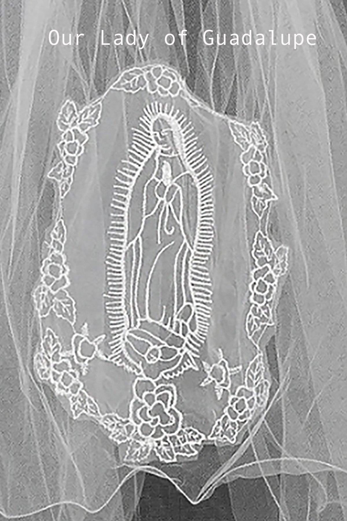 applique with embroidered design of Our Lady of Guadalupe on a plain background