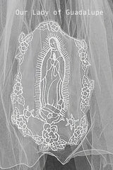 applique with embroidered design of Our Lady of Guadalupe on a plain background