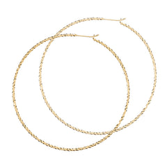 Sparkling Large Hoop earrings in gold, fashioned from our signature diamond cut wire.