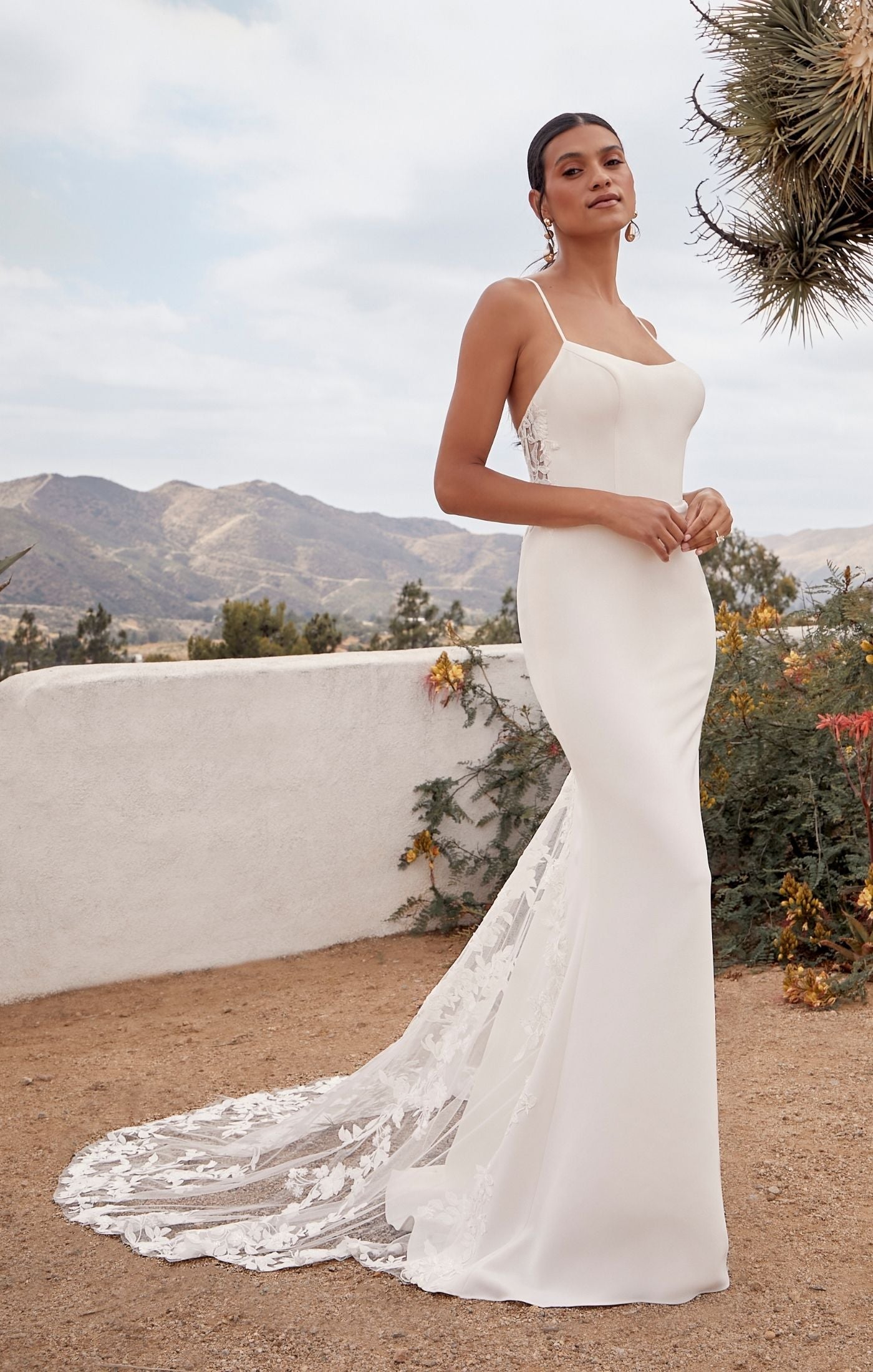 Casablanca Beloved BL429 Arizona Fit And Flare Scoop Neck Spaghetti Strap Floral Lace With Sequin Train Wedding Gown. The fit and flare silhouette of Style BL429 Arizona is both flattering and timeless. The scoop neckline and delicate spaghetti straps exude femininity and grace, beautifully accentuating your collarbone and shoulders. Crafted from stretch lining, stretch matte satin, and floral lace with sequins, Arizona offers a luxurious and comfortable fit.