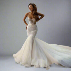 Bride wearing Valentina bridal gown with a sculpted mermaid silhouette and lace appliques
