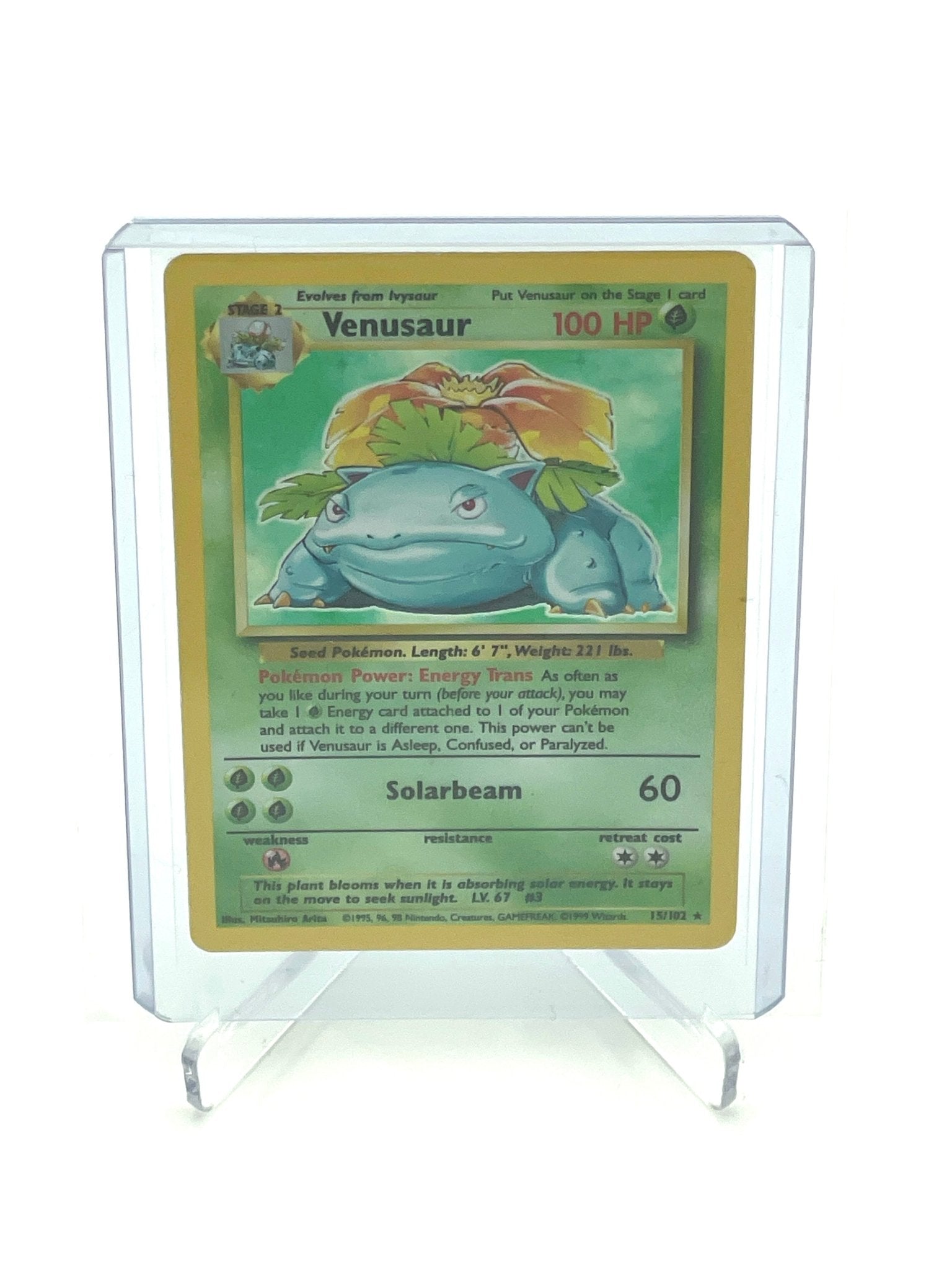 Venusaur Pokemon kort forside med 100 HP og Solarbeam angreb, vist i en beskyttelsesramme.