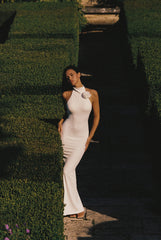 Ivory high neck open back floral dress by WISKII, featuring a fitted silhouette and elegant floral pattern.