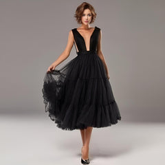 Woman wearing black Zara Formal Dress in soft tulle A-line party dress with a tiered tulle skirt.